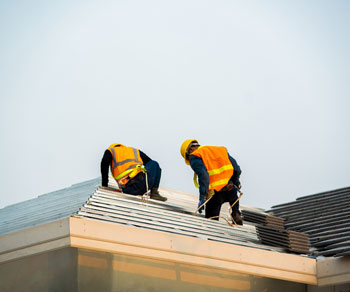 roofers installing roof