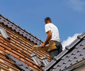 contractor checking the roof